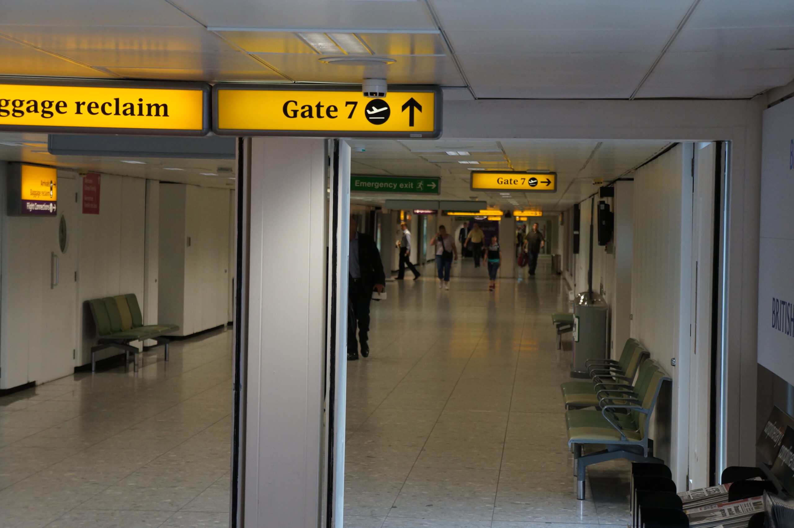 a group of people walking in an airport