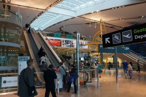 a group of people walking on an escalator