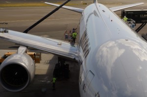 a plane with a few workers on it