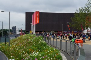 a group of people walking in front of a building