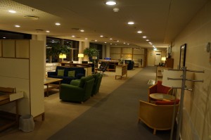 a room with a few chairs and tables