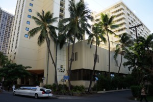 a palm trees next to a building