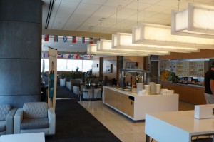 a room with a white counter and chairs