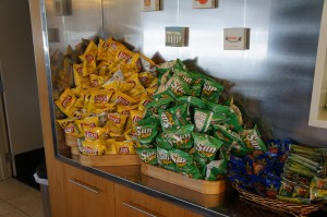 a group of bags of chips in a basket