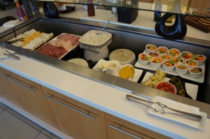 a buffet line with different types of food