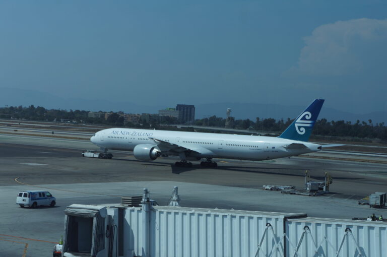 a large white airplane on a runway