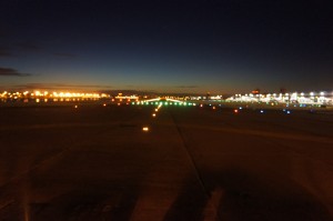a runway at night with lights on