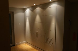 a room with a door and a light on the wall