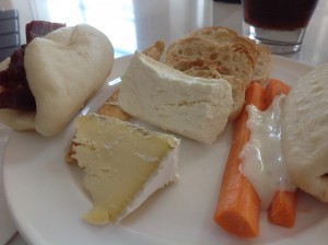 a plate of food with a glass of liquid