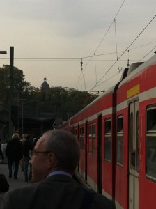 a man standing next to a train
