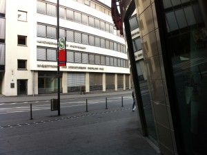 a street corner with a building in the background