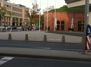 a street with a brick building and a red building