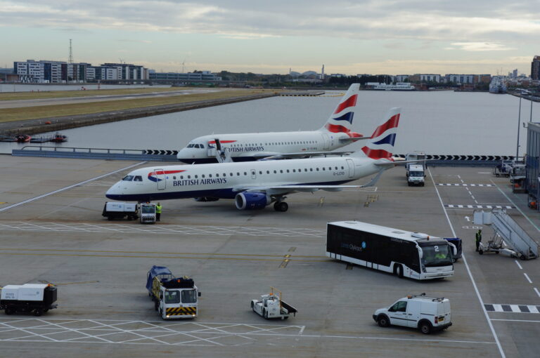 a group of airplanes on a runway