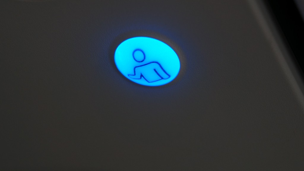 The flight attendant call buttons are blue on the A318