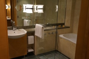 a bathroom with a glass shower door