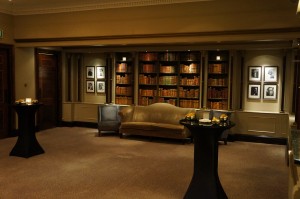 a room with a couch and bookshelves