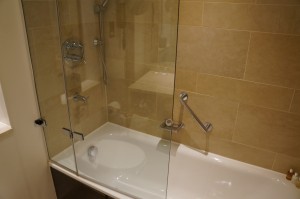 a glass shower door in a bathroom
