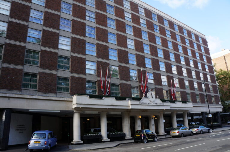 a building with cars parked on the side of it