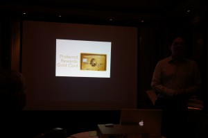 a man standing in front of a projector screen