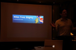 a man standing in front of a screen