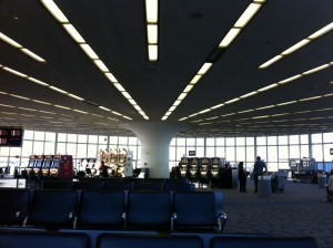 a room with a few seats and a slot machine