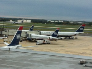 several airplanes parked at an airport