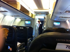 a group of people sitting in an airplane
