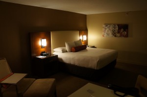 a hotel room with a bed and a table