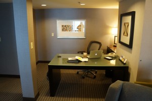 a desk in a room with a laptop