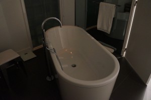 a white bathtub in a bathroom