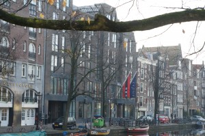 a city street with boats and buildings