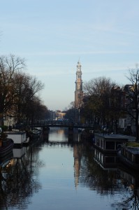 a water way with a tower in the background
