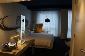 a room with a bed and a mirror