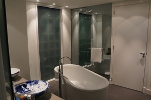 a bathroom with a tub and a sink