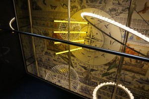 a glass case with a light fixture