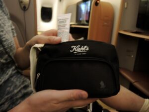 a person holding a small black bag