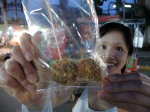a woman holding a bag of food