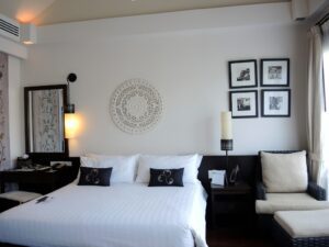 a bedroom with a bed and a couch