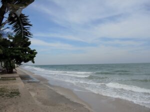 a beach with waves crashing on the shore