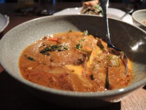 a bowl of soup with a spoon