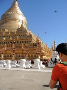a man looking at a large building