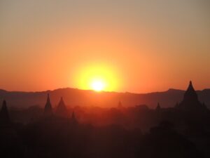 a sunset over a city