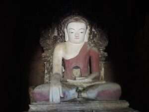a statue of a person sitting in a lotus position