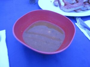 a bowl of soup and sausages