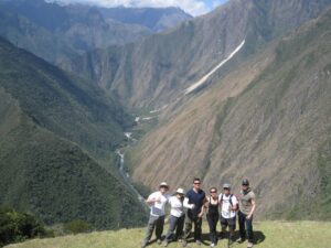 a group of people standing on a mountain
