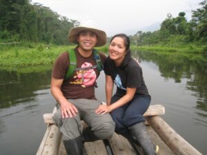 a man and woman sitting on a raft