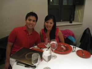 a man and woman sitting at a table