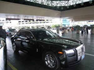 a black car parked in a parking lot
