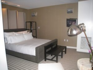 a bedroom with a bed and a fireplace