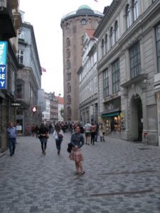 a group of people walking on a street
